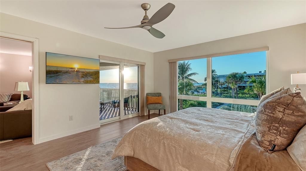 5757 Gulf Of Mexico Drive, Unit 204 Longboat Key, FL 34228 - Photo 40 of 71 a bed sitting in a spacious bedroom next to a window