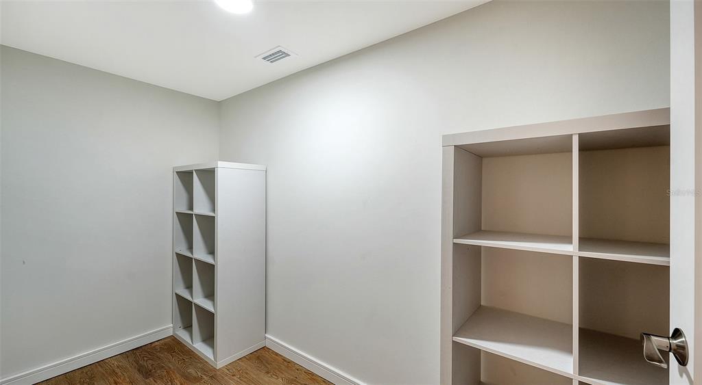 5757 Gulf Of Mexico Drive, Unit 204 Longboat Key, FL 34228 - Photo 43 of 71 a view of walk in closet with empty racks