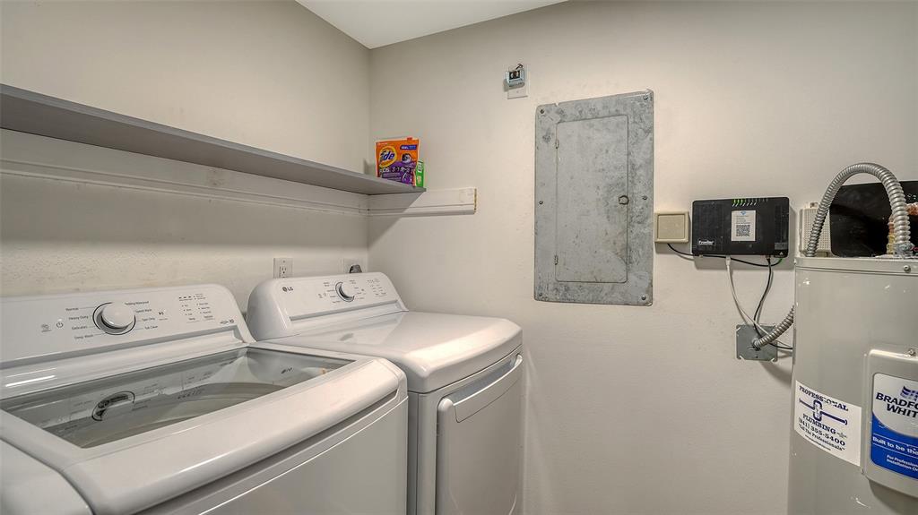 5757 Gulf Of Mexico Drive, Unit 204 Longboat Key, FL 34228 - Photo 52 of 71 a utility room with dryer and washer