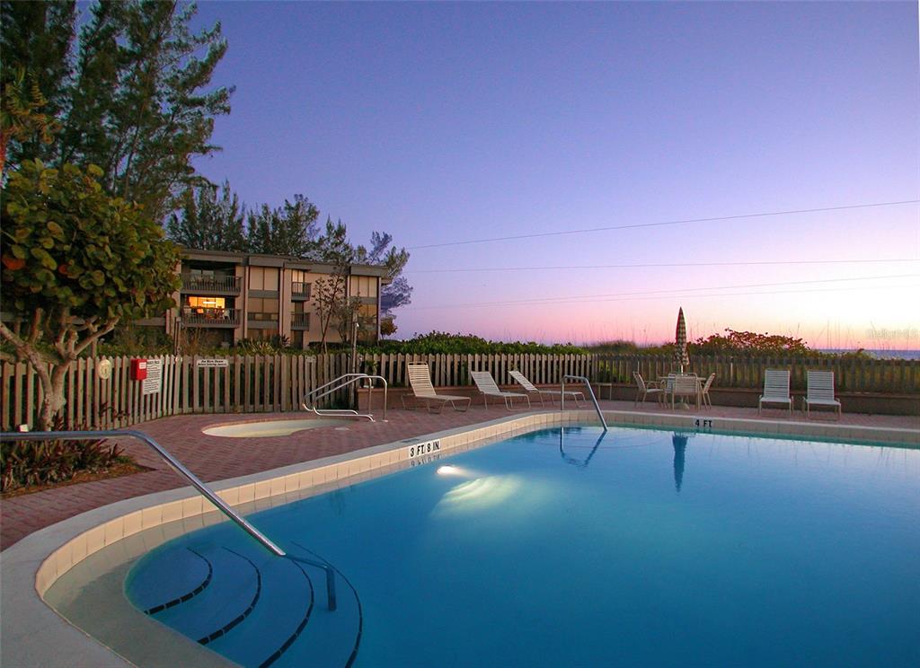 5757 Gulf Of Mexico Drive, Unit 204 Longboat Key, FL 34228 - Photo 63 of 71 a view of a swimming pool with a lounge chair