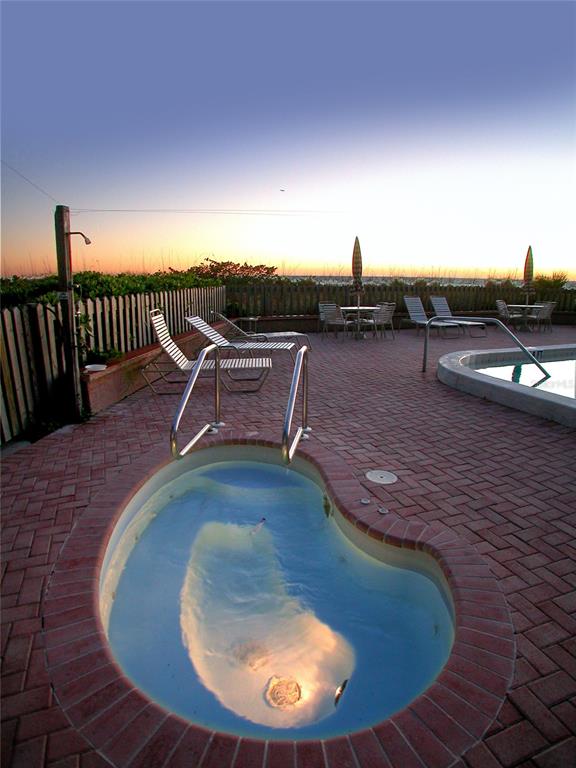 5757 Gulf Of Mexico Drive, Unit 204 Longboat Key, FL 34228 - Photo 67 of 71 a view of a swimming pool with a lounge chair