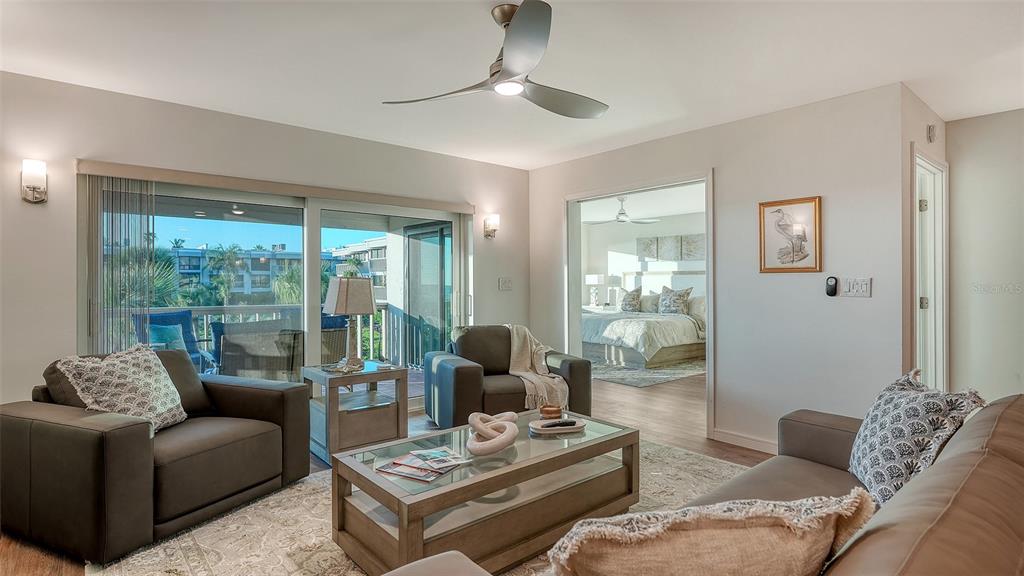 5757 Gulf Of Mexico Drive, Unit 204 Longboat Key, FL 34228 - Photo 9 of 71 a living room with furniture and a window