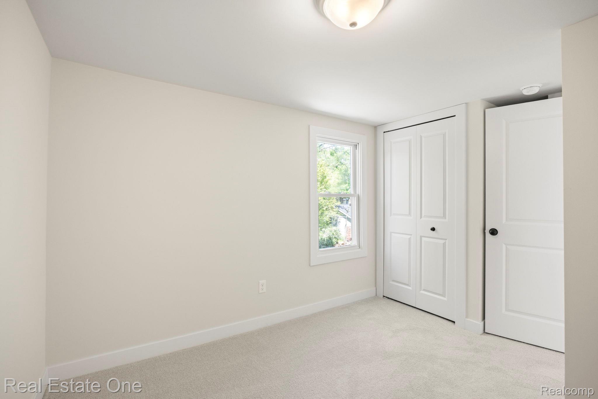 3200 Hessel Avenue Rochester, MI 48307 - Photo 19 of 32 Unfurnished bedroom featuring light colored carpet and a closet