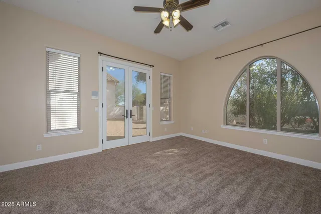 a bathroom with a tub a sink and a mirror
