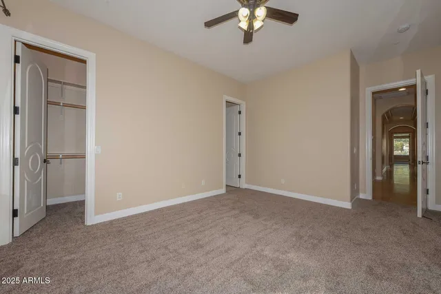 a kitchen with granite countertop white cabinets and sink