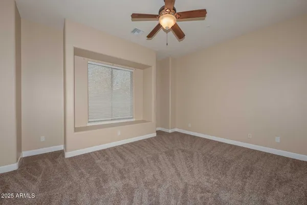 a view of empty room with closet