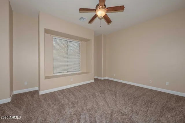 a view of empty room with closet