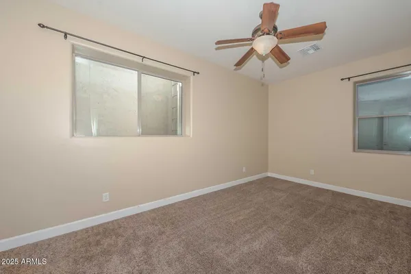 a large kitchen with stainless steel appliances granite countertop a stove a sink a refrigerator and a granite counter tops