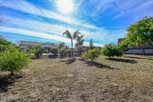 a view of a lobby with a chandelier fan and windows