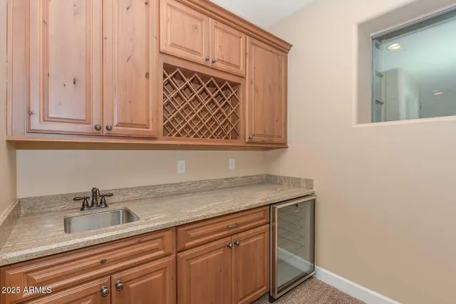 a view of a hallway with wooden floor and cabinet