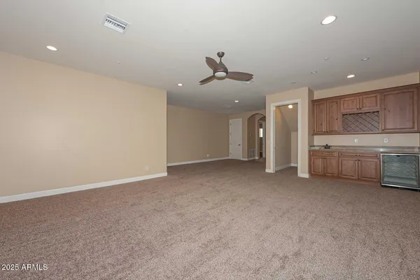 a kitchen with stainless steel appliances granite countertop a stove and a refrigerator