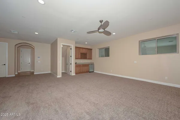 a kitchen with stainless steel appliances granite countertop a sink counter space cabinets and a large window