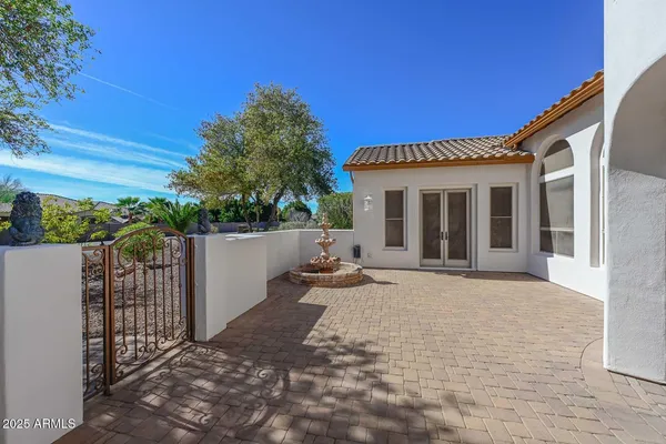 a view of a house with outdoor space and sitting area