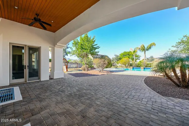 a view of an house with backyard space and garden