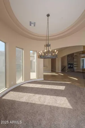 a view of a livingroom with a ceiling fan and window