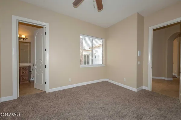 a bathroom with a granite countertop toilet a sink and a bathtub