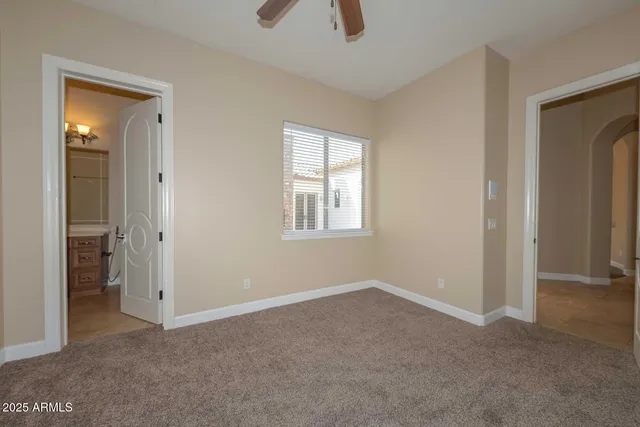 a bathroom with a granite countertop toilet a sink and a bathtub