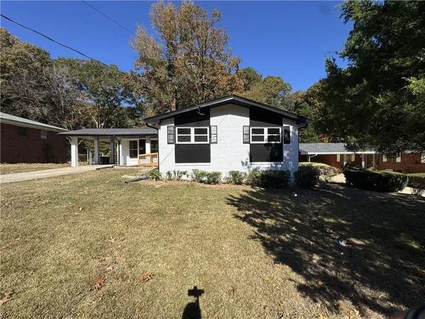 a front view of a house with a yard