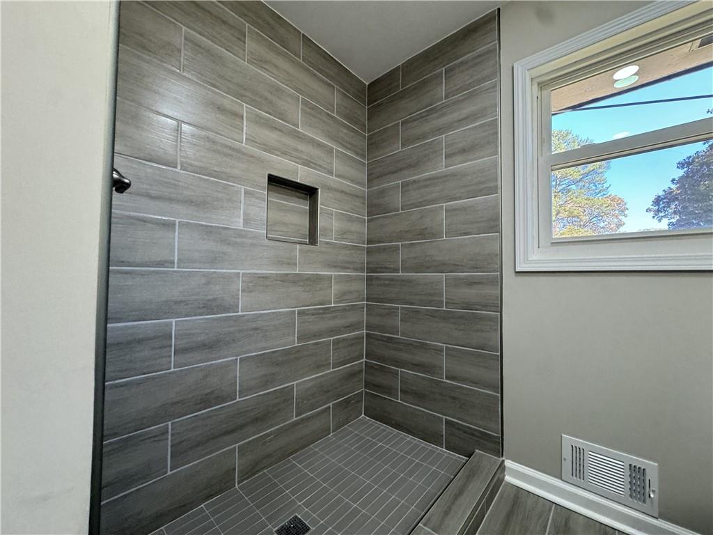 3489 Creighton Road Southwest Atlanta, GA 30331 - Photo 14 of 53 a bathroom with a shower