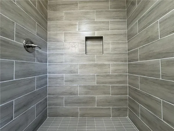 a bathroom with a toilet a sink and bathtub