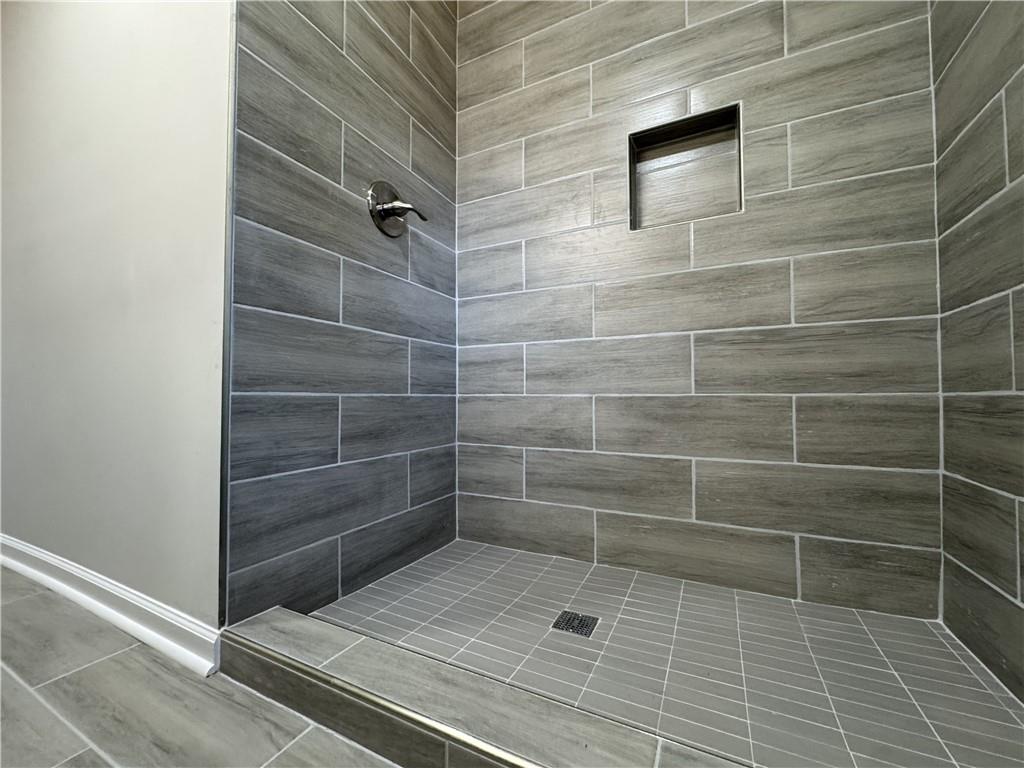 3489 Creighton Road Southwest Atlanta, GA 30331 - Photo 20 of 53 a bathroom with a glass door shower