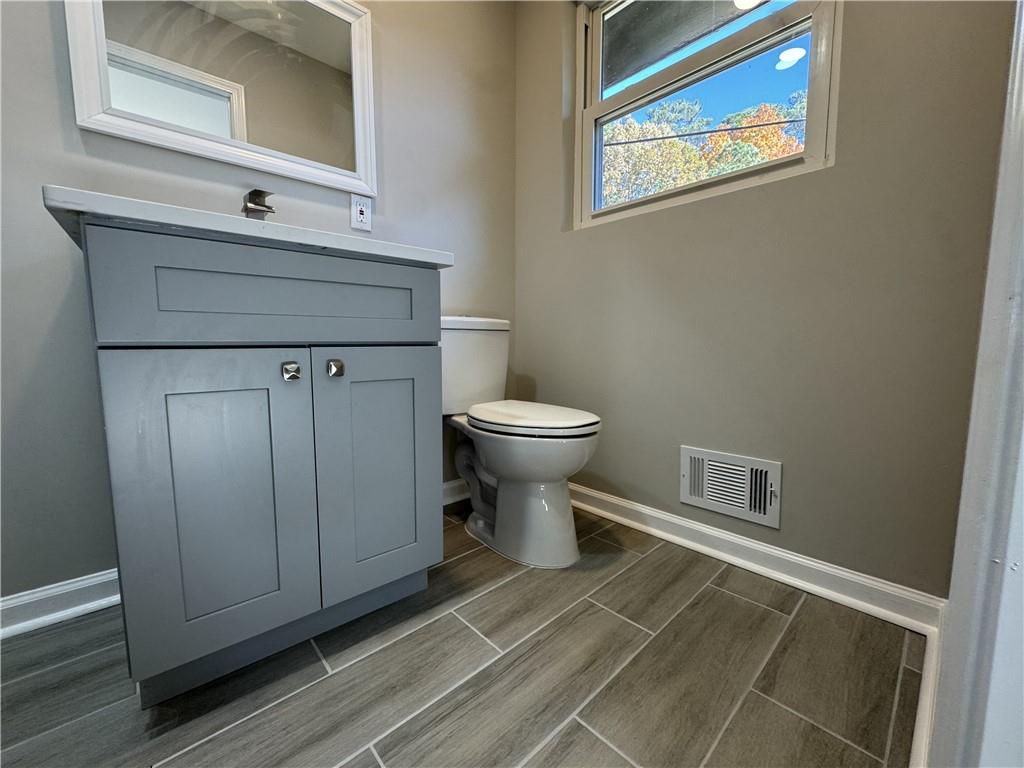 3489 Creighton Road Southwest Atlanta, GA 30331 - Photo 28 of 53 a bathroom with a toilet and a sink