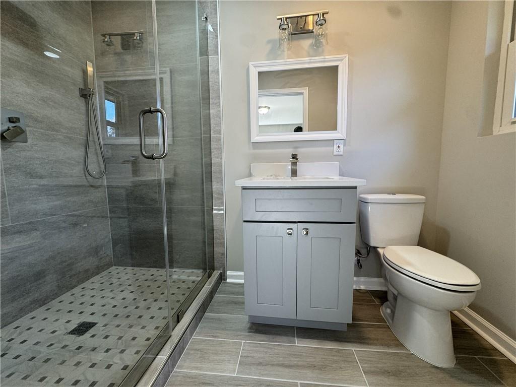 3489 Creighton Road Southwest Atlanta, GA 30331 - Photo 31 of 53 a bathroom with a sink toilet and shower