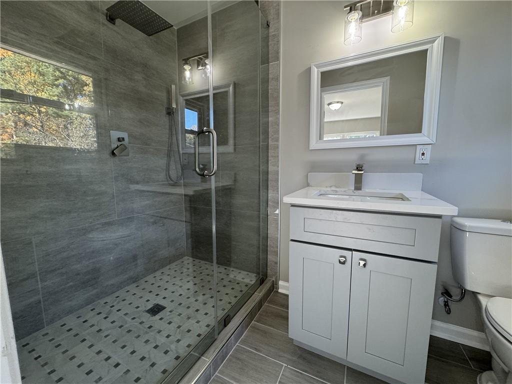 3489 Creighton Road Southwest Atlanta, GA 30331 - Photo 35 of 53 a bathroom with a sink a vanity and a mirror