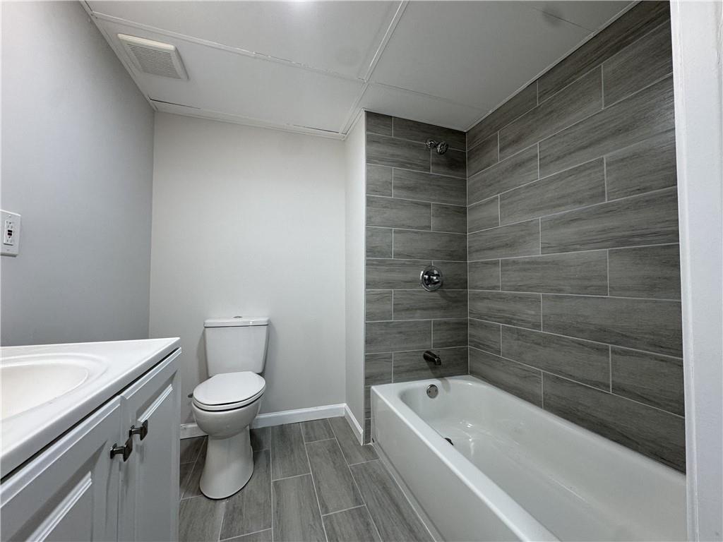 3489 Creighton Road Southwest Atlanta, GA 30331 - Photo 39 of 53 a bathroom with a toilet a sink and bathtub