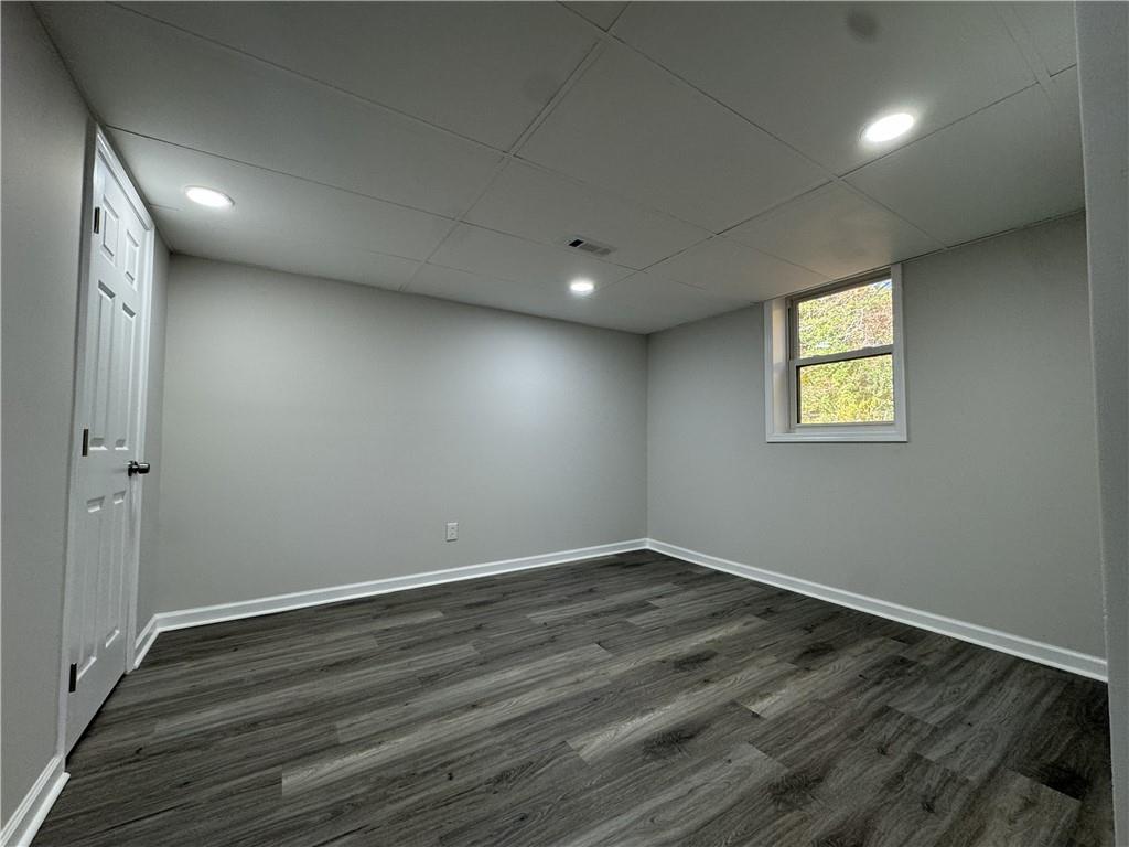 3489 Creighton Road Southwest Atlanta, GA 30331 - Photo 43 of 53 an empty room with wooden floor and windows