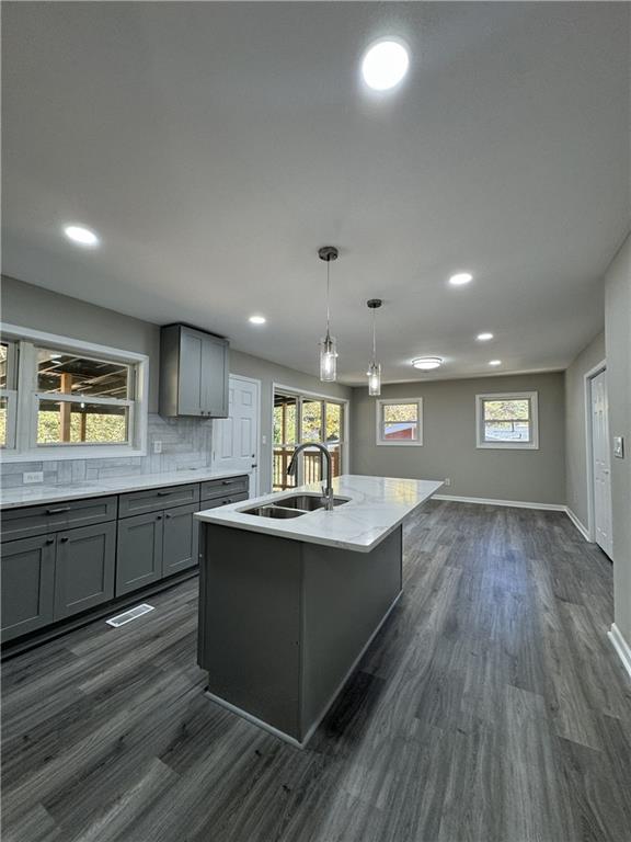 3489 Creighton Road Southwest Atlanta, GA 30331 - Photo 48 of 53 a kitchen with stainless steel appliances granite countertop a sink dishwasher stove and wooden floor