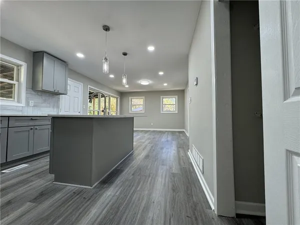 a bathroom with a glass door shower