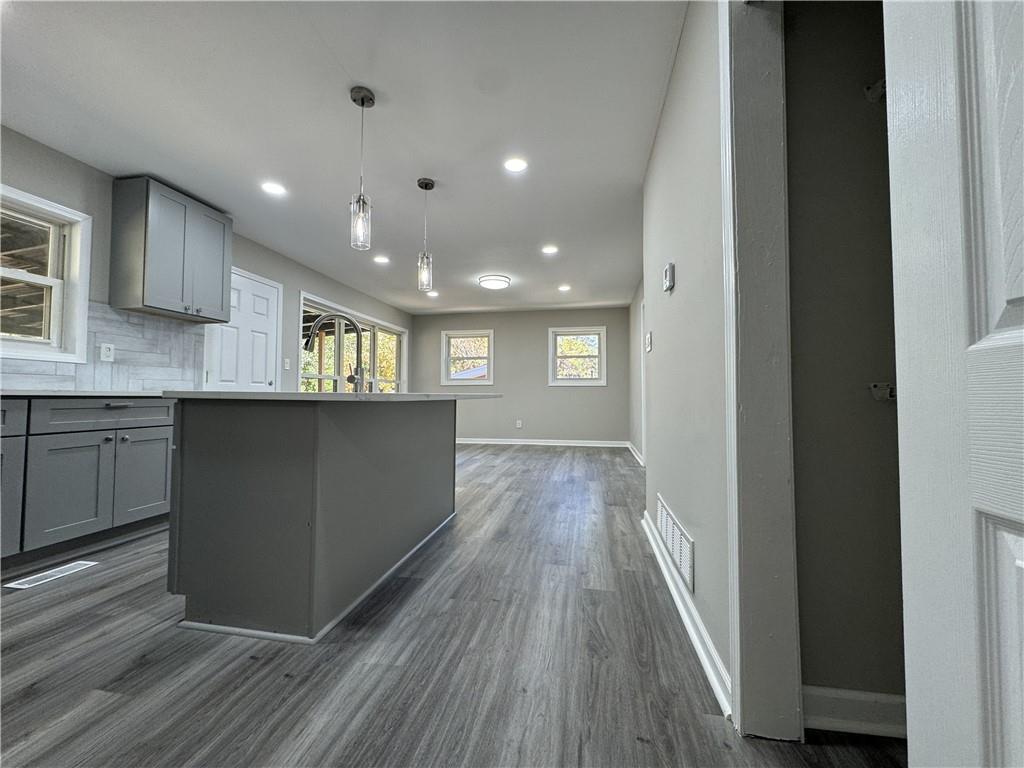 3489 Creighton Road Southwest Atlanta, GA 30331 - Photo 8 of 53 a view of a kitchen with a sink and wooden floor