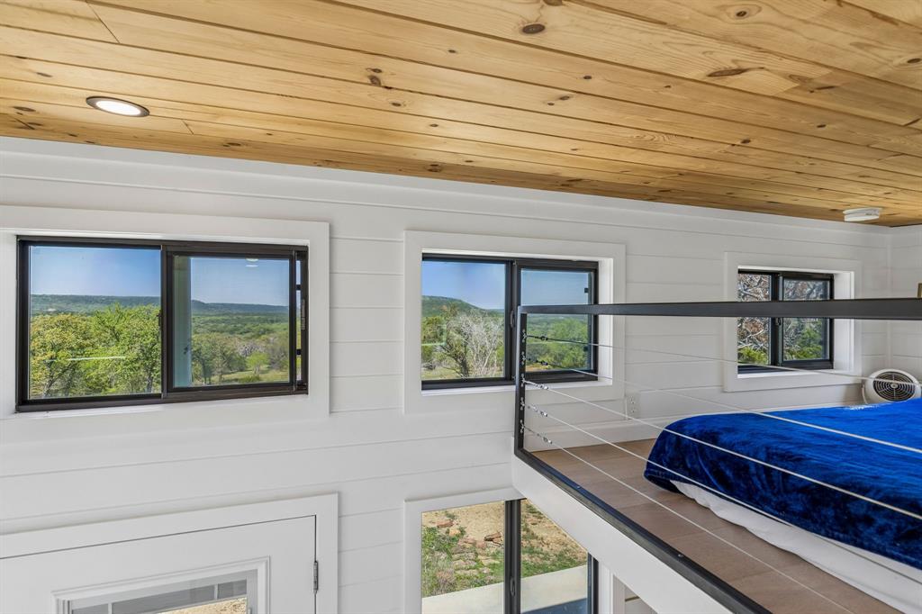 122 Western Sky Drive Ranger, TX 76470 - Photo 12 of 40 a view of a room with wooden floor and a window