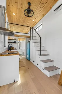 a view of a storage & utility room with stairs