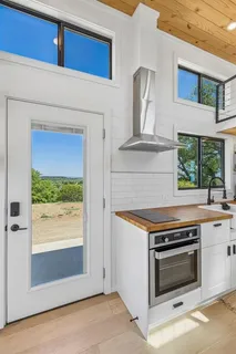 a kitchen with a stove and a microwave