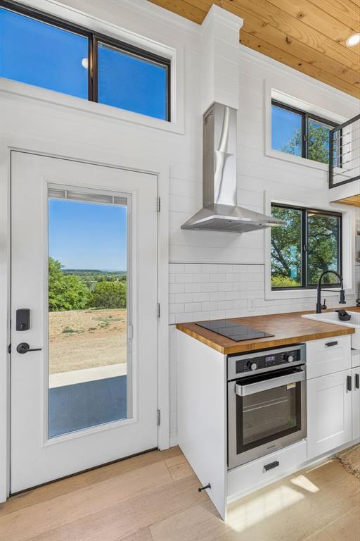 122 Western Sky Drive Ranger, TX 76470 - Photo 27 of 40 a kitchen with a stove and a microwave