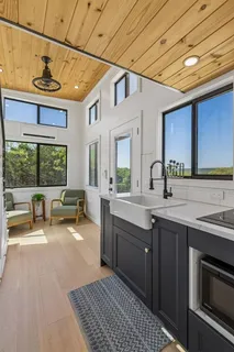 a kitchen with a sink stove and cabinets