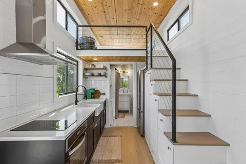 a kitchen that has a lot of cabinets in it