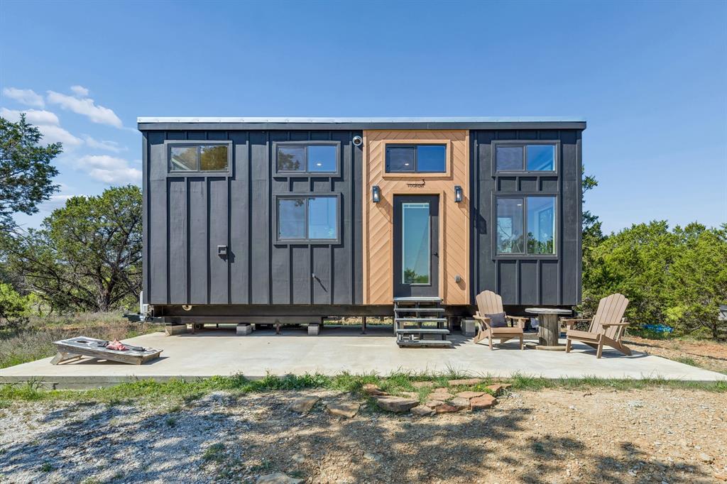 122 Western Sky Drive Ranger, TX 76470 - Photo 34 of 40 a view of a house with backyard and trees