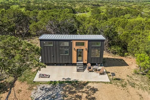 a front view of a house with yard