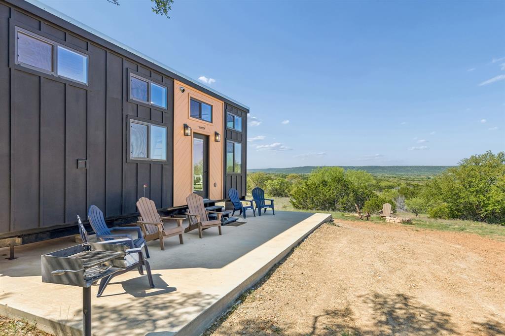 122 Western Sky Drive Ranger, TX 76470 - Photo 38 of 40 a swimming pool with outdoor seating and plants
