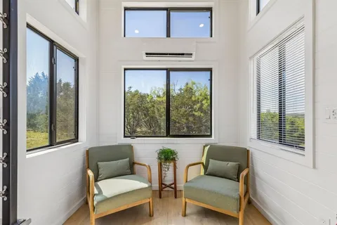 a living room with furniture and a window