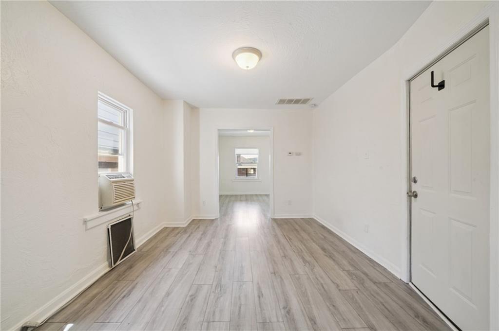 545 Sixth Street Trafford, PA 15085 - Photo 3 of 11 a view of a hallway with wooden floor and a kitchen