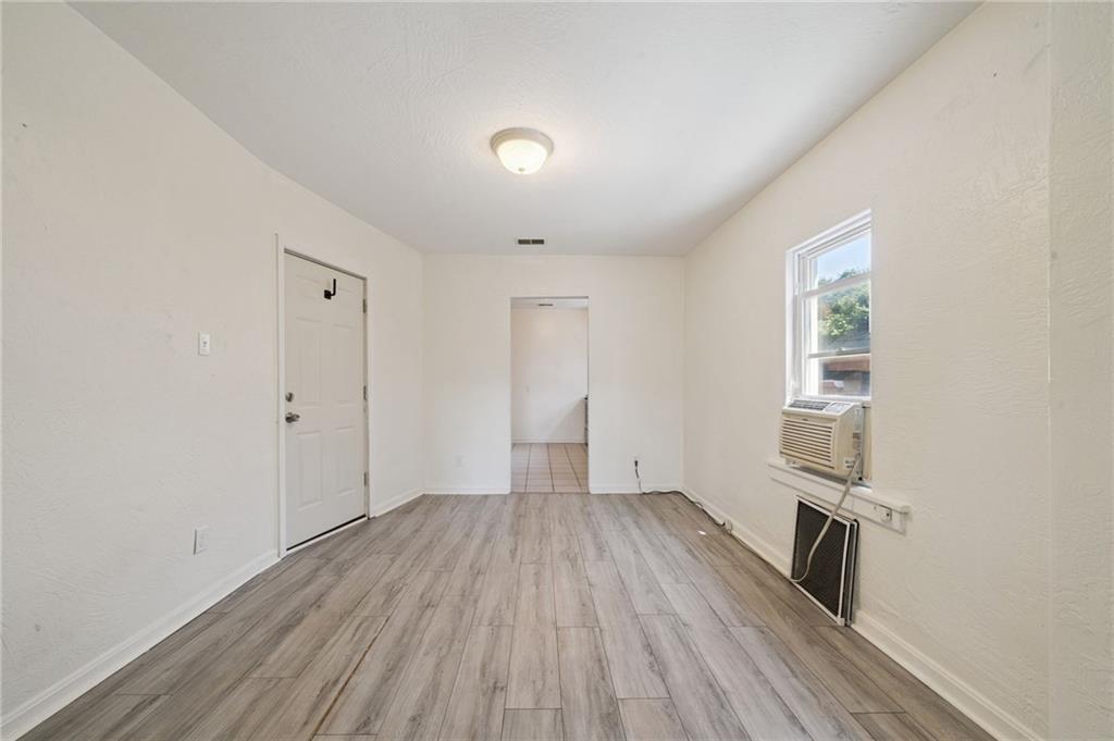 545 Sixth Street Trafford, PA 15085 - Photo 4 of 11 wooden floor in an empty room with a window