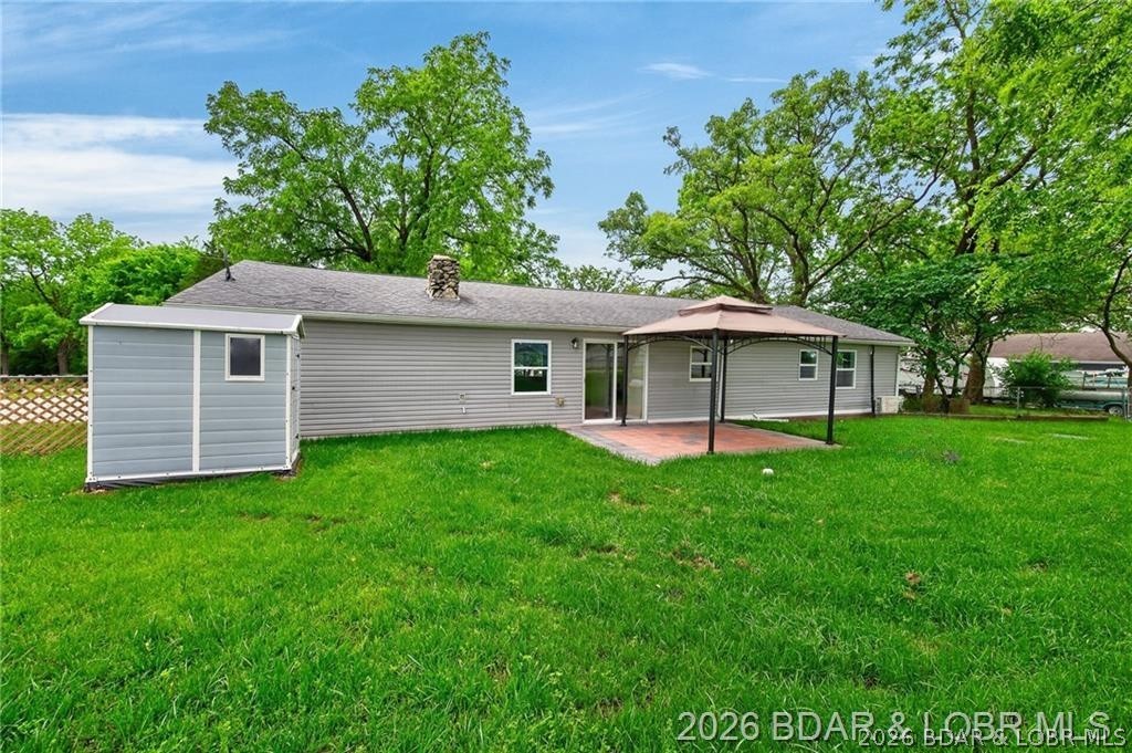 177 Storage Road Eldon, MO 65026 - Photo 28 of 34 Framed by beautiful, established shade trees that