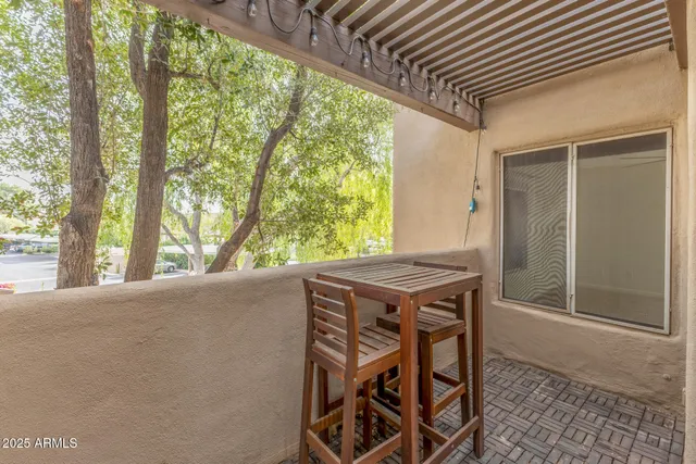 a view of balcony with two chairs