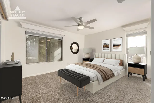 a bedroom with bed and a chandelier