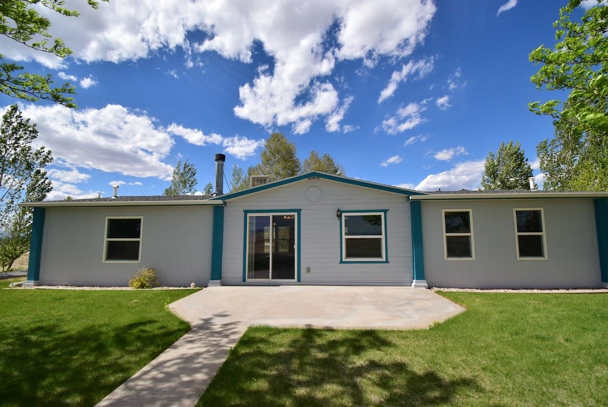 19548 B50 Road Delta, CO 81416 - Photo 31 of 37 a backyard of a house with lots of green space