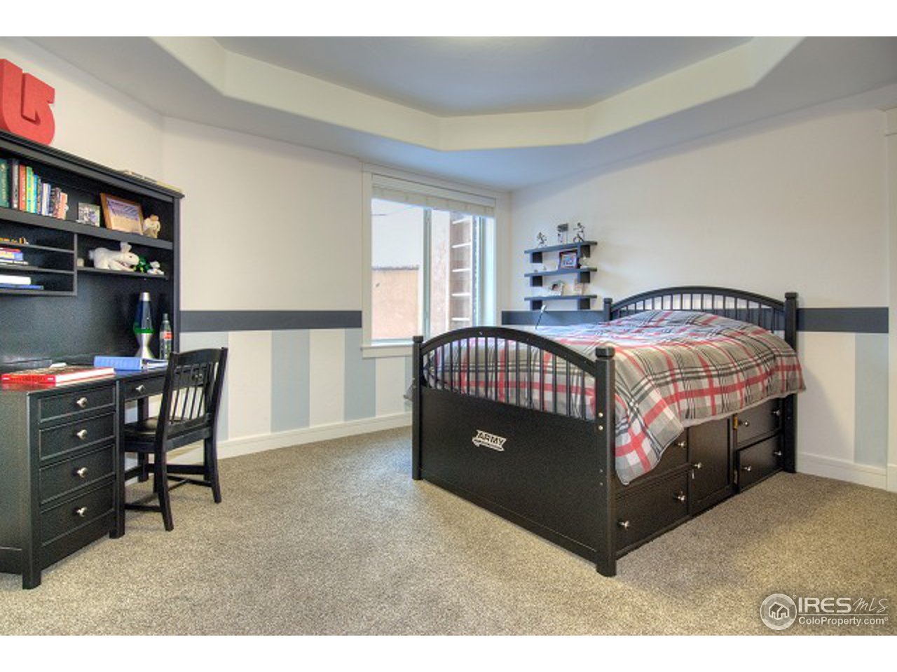 10154 Lookout Road Lafayette, CO 80026 - Photo 11 of 18 a bedroom with a bed window and a night stand in it